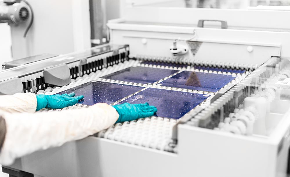 Woman operating chemical etching machine