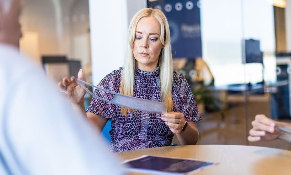 Lady inspecting photochemically etched components