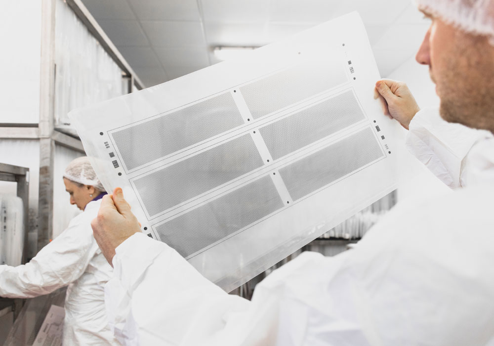 Chemical etcher holding a photo tool featuring stainless steel etched filters