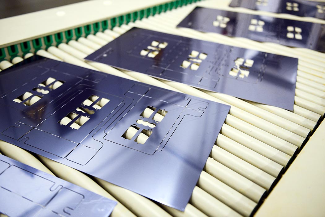 Etched aluminium sheet being processed